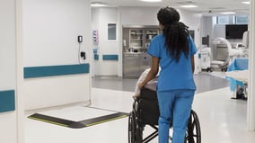 seca_XLine_Base_patient_nurse_pushing_wheelchair